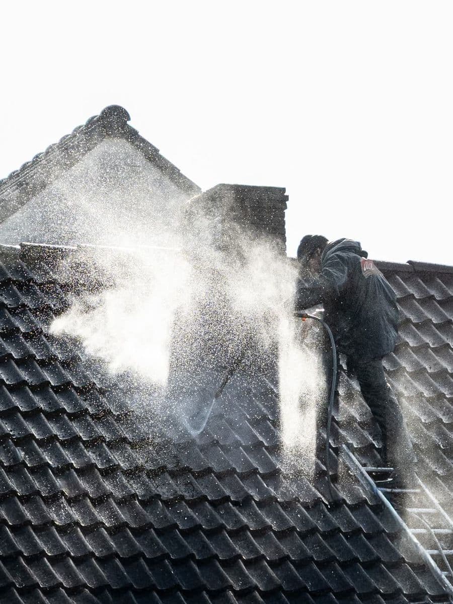 Roof being soft washed